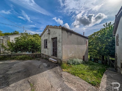 House in need of renovation with a view of the countryside