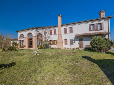 Well-maintained villa surrounded by greenery