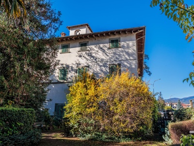 Property in need of renovation with well-tended garden